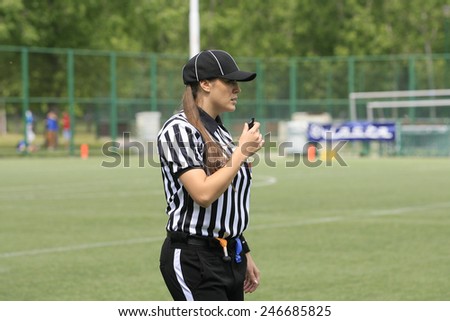 Belgrade, Serbia - May 05, 2014: The only female football referee Ivana Lazic in Serbia. American Football Match Between Belgrade Wolves And Blue Dragon in Belgrade. The Wolves team is winner.