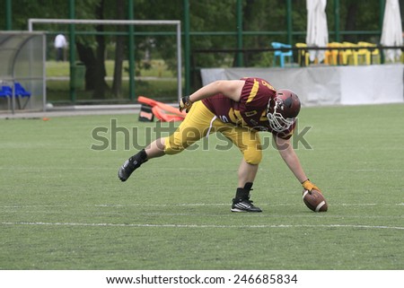 Belgrade, Serbia - May 05, 2014: The player catches the ball. American Football Match Between Belgrade Wolves And Blue Dragon in Belgrade. The Wolves team is winner.