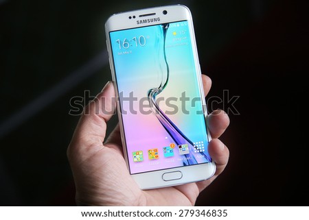 Belgrade, Serbia - May 16, 2015: Mobile phone White Pearl Samsung Galaxy 6 EDGE With curved glass and metal with 16 mp Camera.