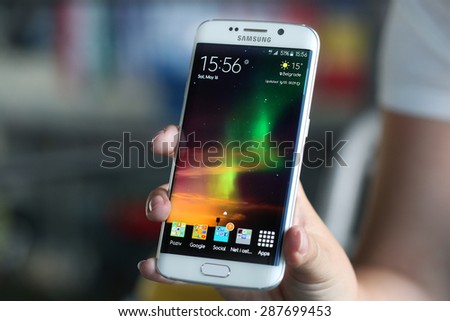 Belgrade, Serbia - May 16, 2015: Mobile phone White Pearl Samsung Galaxy 6 EDGE With curved glass and metal with 16 mp Camera.
