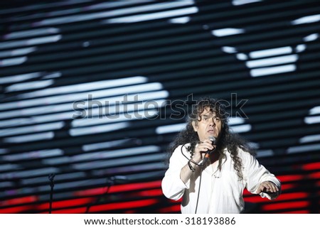 Belgrade, Serbia - August 20, 2015: The singer on stage and lights at Traditional Beer Fest in Belgrade, next to good music to audience offered and beer, this year lasted 6 days.