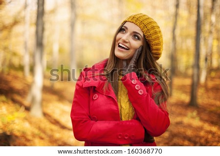 Happy woman wearing fashion autumn clothes