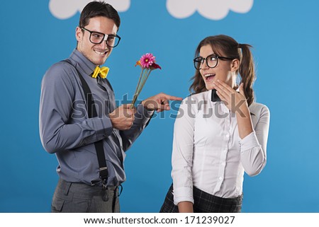 Portrait of flirting nerdy couple