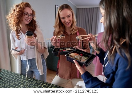 Similar – Image, Stock Photo Ethnic businesswoman eating sushi and working on laptop in cafe