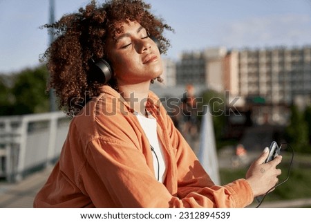 Similar – Image, Stock Photo Pensive black woman on urban pavement in daytime