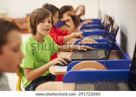 Pupils sitting at the computer science lesson