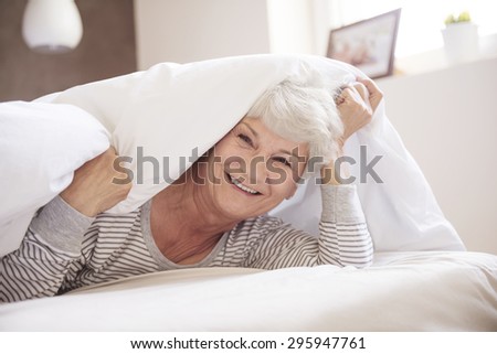 Rested senior woman in her bedroom
