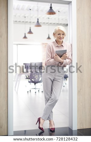 Similar – Image, Stock Photo Woman leaning against door in front of red wall