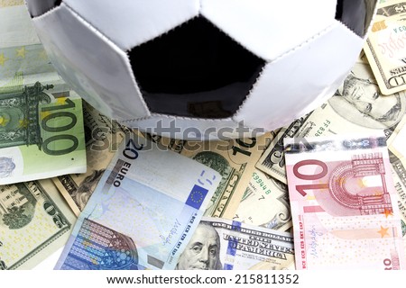 soccer ball over a lot of money