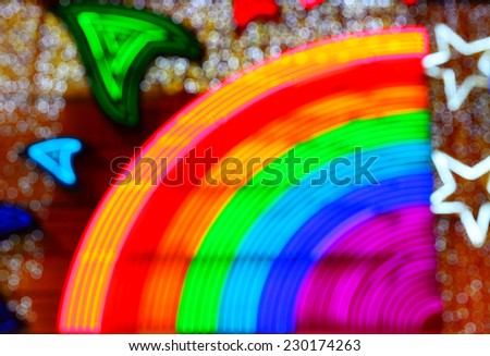 Colorful night rainbow facade illumination, blurred image as abckground