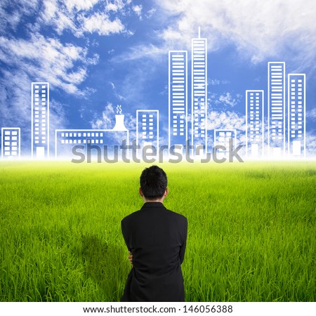 Businessman look city on skyline in future