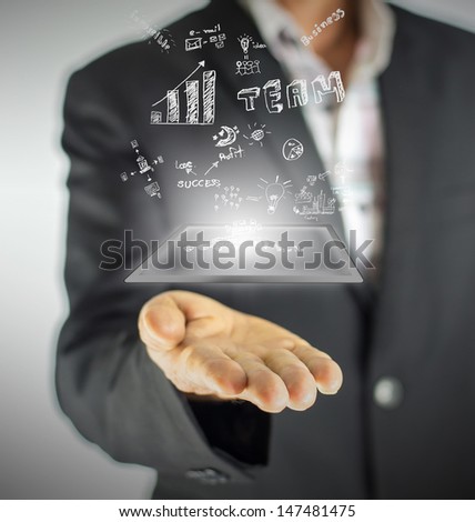 Businessman hold digital tablet and  has business concept in air