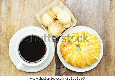 Black coffee and cookies and pineapple bread