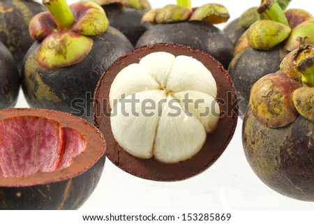isolate mangosteen on white background, the tropical purple fruit in Thailand