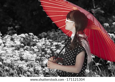 Little retro fashioned girl walks at the park with a red umbrella/Retro Parasol Girl
