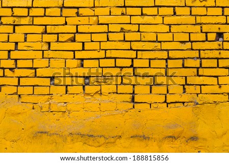 Vintage yellow brick wall partly facing with concrete/Yellow Brick Wall