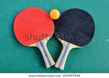 ping-pong bat and ball on table tennis.