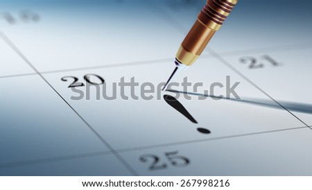 A dart stick on Calendar. Concept image of a Calendar with a shiny golden dart stick. Closeup shot of a dart attached.