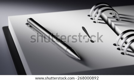 Closeup of a personal agenda, organizer or planner, setting an important date with a Ballpoint pen marking a day of the month representing a organizing time and schedule.