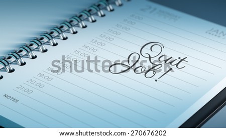 Closeup of a personal calendar setting an important date representing a time schedule. The words Quit job written on a white notebook to remind you an important appointment.