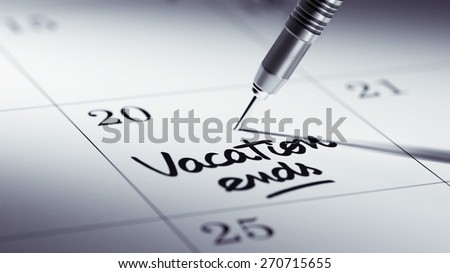 Concept image of a Calendar with a golden dart stick. The words Vacation ends written on a white notebook to remind you an important appointment.
