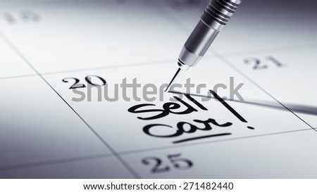 Concept image of a Calendar with a golden dart stick. The words Sell Car written on a white notebook to remind you an important appointment.