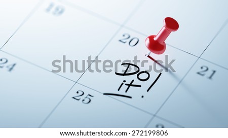 Concept image of a Calendar with a red push pin. Closeup shot of a thumbtack attached. The words Do it written on a white notebook to remind you an important appointment.