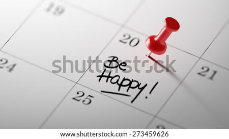 Concept image of a Calendar with a red push pin. Closeup shot of a thumbtack attached. The words Be happy written on a white notebook to remind you an important appointment.