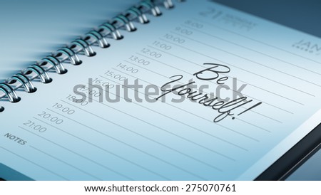 Closeup of a personal calendar setting an important date representing a time schedule. The words be yourself written on a white notebook to remind you an important appointment.
