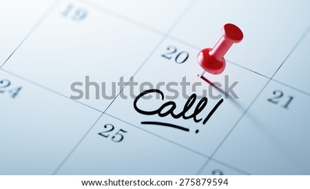 Concept image of a Calendar with a red push pin. Closeup shot of a thumbtack attached. The words Call written on a white notebook to remind you an important appointment.
