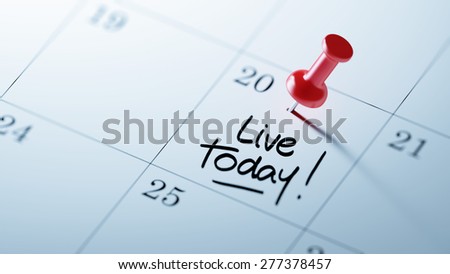 Concept image of a Calendar with a red push pin. Closeup shot of a thumbtack attached. The words Live today written on a white notebook to remind you an important appointment.