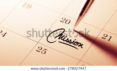 Closeup of a personal agenda setting an important date written with pen. The words Mission written on a white notebook to remind you an important appointment.