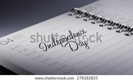 Closeup of a personal calendar setting an important date representing a time schedule. The words Independence Day written on a white notebook to remind you an important appointment.