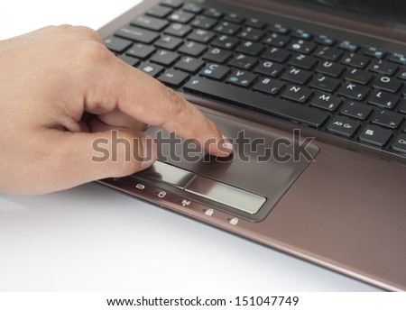 Human finger on the Touchpad and Keyboard