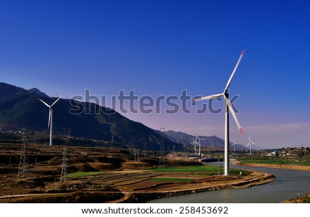 Rivers, mountains and the wind turbine to generate electricity