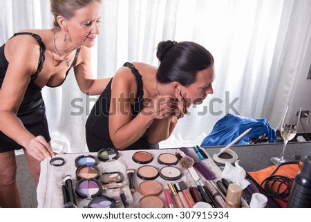 two attractive women and their make up