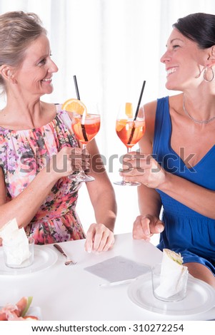 two attractive women having a light dinner