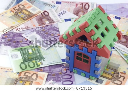 House made of blocks over  money background