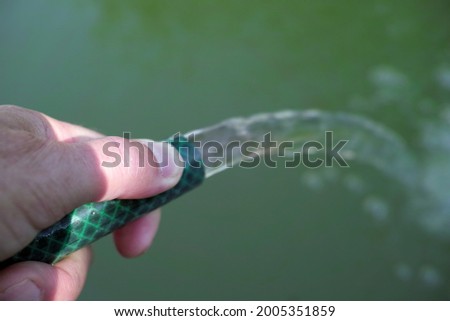 Similar – Foto Bild Wasser gefüllter Teich mit Schilfgras, Schilfrohr Gräsern in Art einer Weitwinkelaufnahme als Beispiel der Schönheit der Natur in ihren Farben und Formen mit Himmel