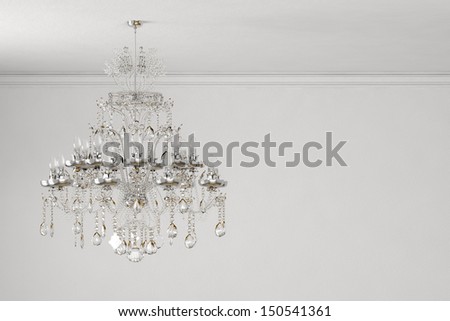 old chandelier on white wall with copy space