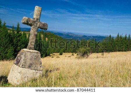 mountain landscape with old cross. nature
