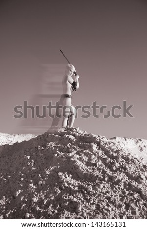 militant girl with sword in morning light