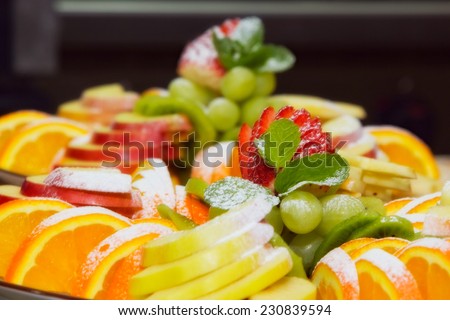 cutting fruits on plate. sweet food