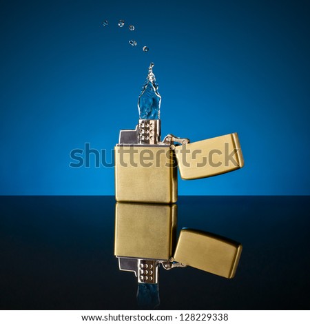 lighter and the flame out of the water on a blue glass background