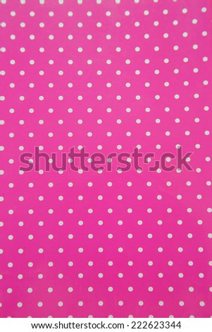 Pink background with white polka dots