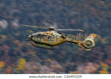 AXALP, SWITZERLAND - OCTOBER 11: Swiss Airforce Eurocopter 635P2+ during training before Axalp Swiss Air Force Live Firing Demo on October 11, 2011 in Axalp, Switzerland