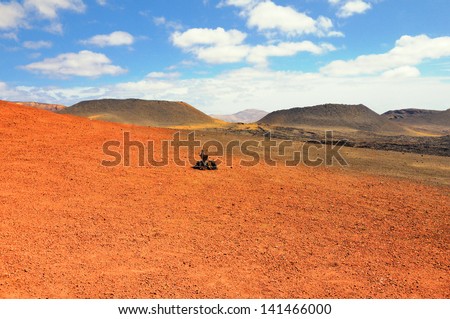 Arid landscape with volcanoes, in Timanfaya National Park, Lanzarote, Spain