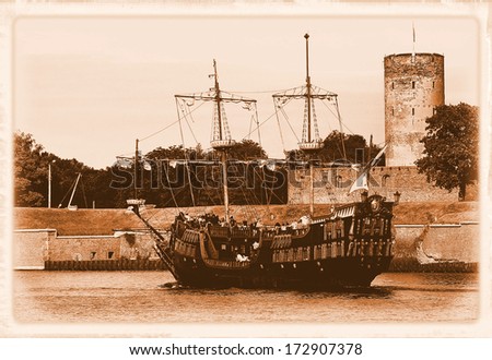 Old Galleon and Wisloujscie Fortress in port of Gdansk, Poland.- styling at an old photograph