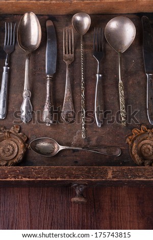 Old cutlery in an old wooden box with copy space