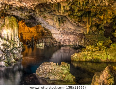 Image, Stock Photo Rough cave near sea during sunset